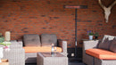 Sunred Dark pe stativ langa un set lounge, pe o terasa acoperita